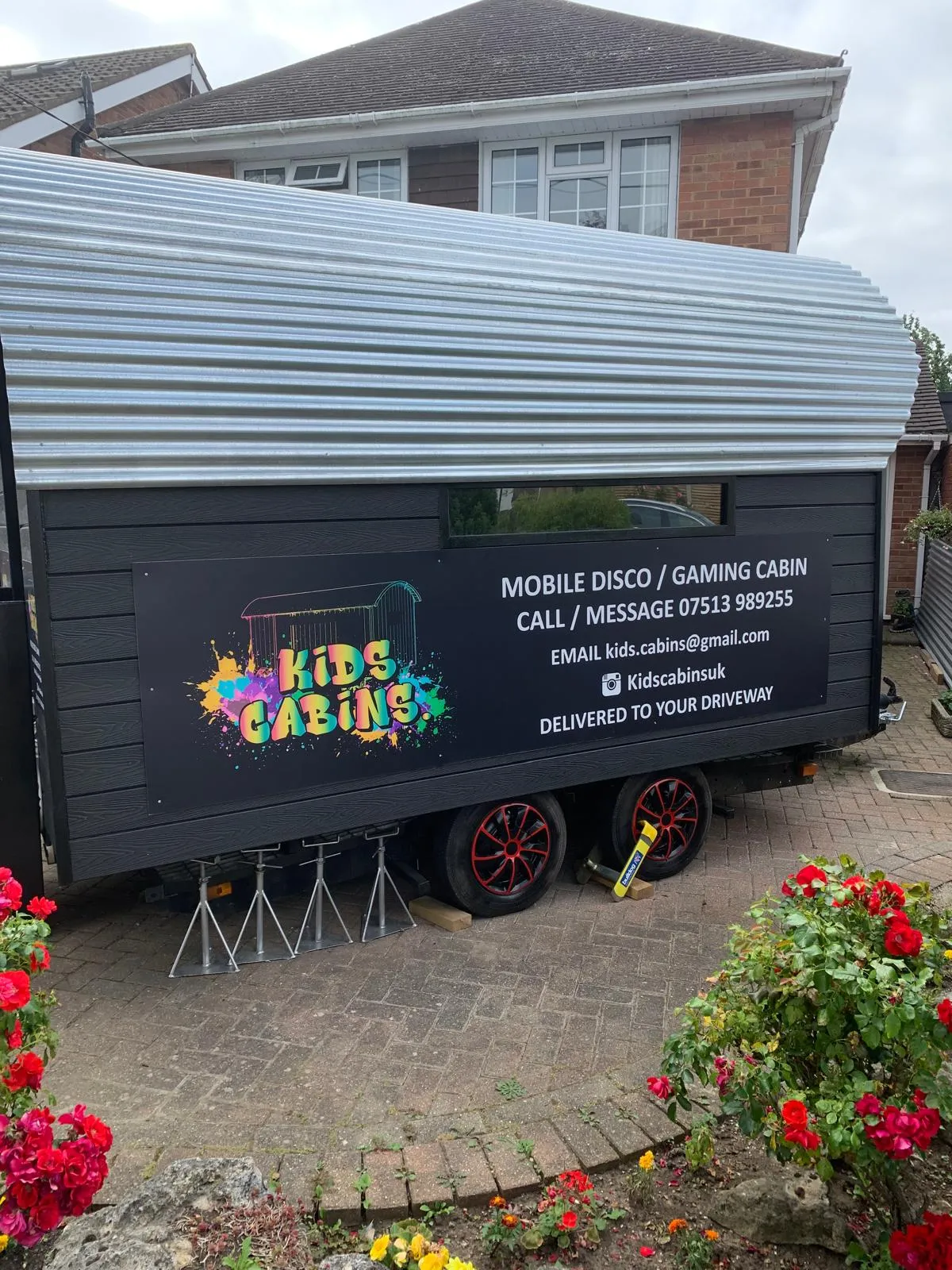Kids Cabin parked on a driveway