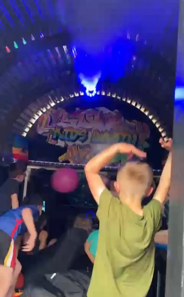 Kids playing inside the gaming and disco cabin